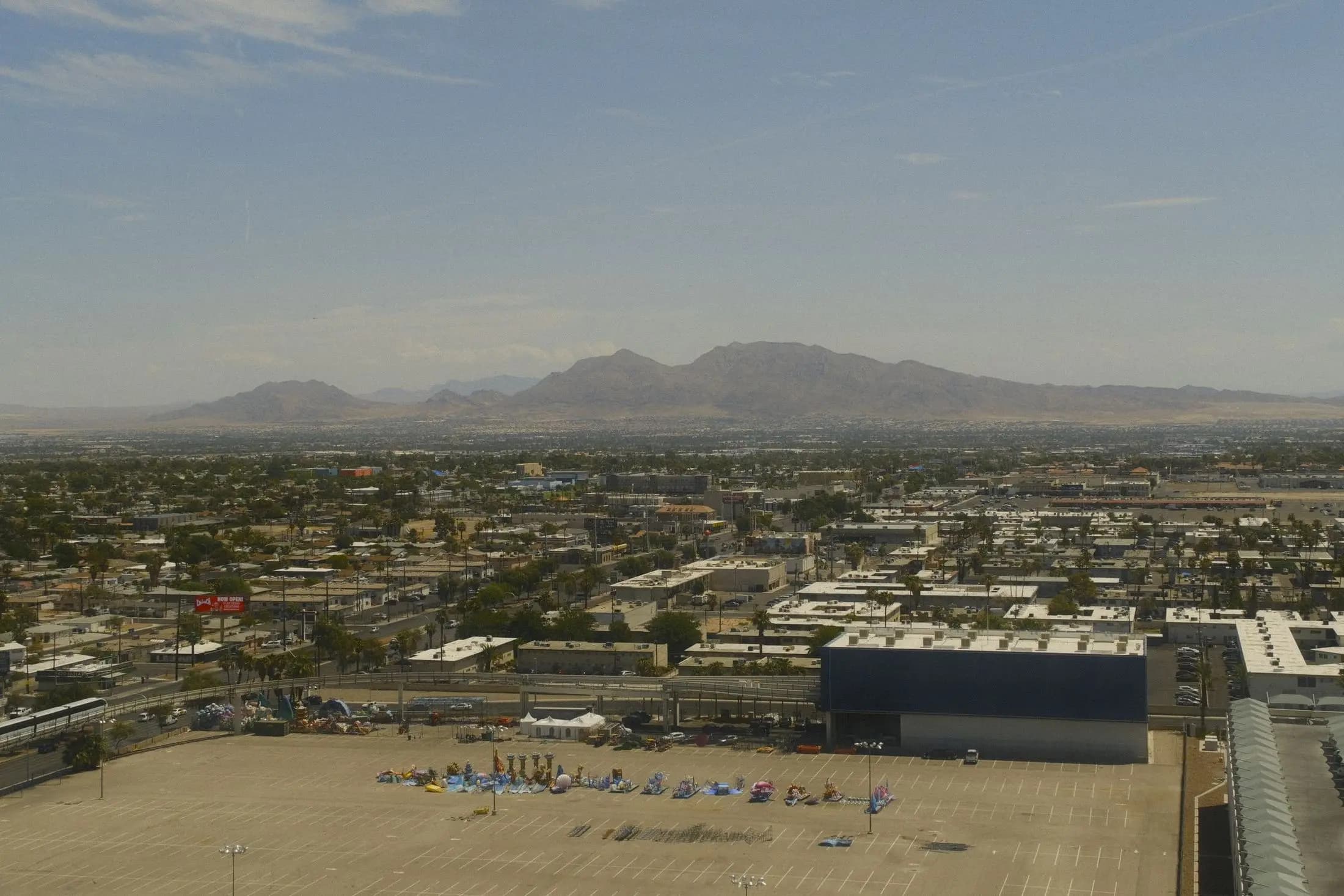 Suburbs of the Las Vegas Valley with a graded lot in the foreground and mountains beyond