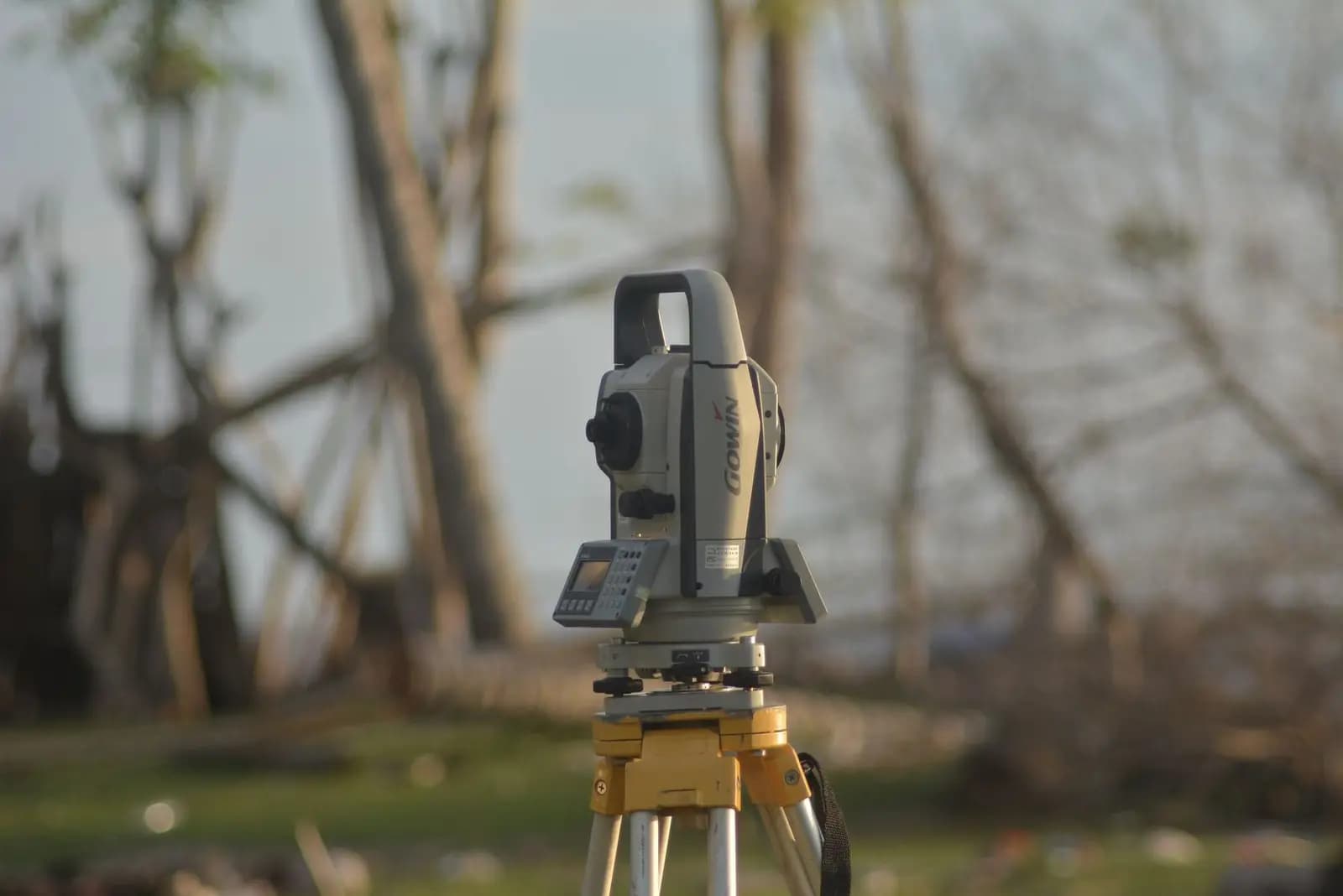 A total station survey instrument on its tripod